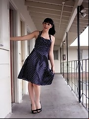 Seductive transsexual Bailey Jay stripping in a motel